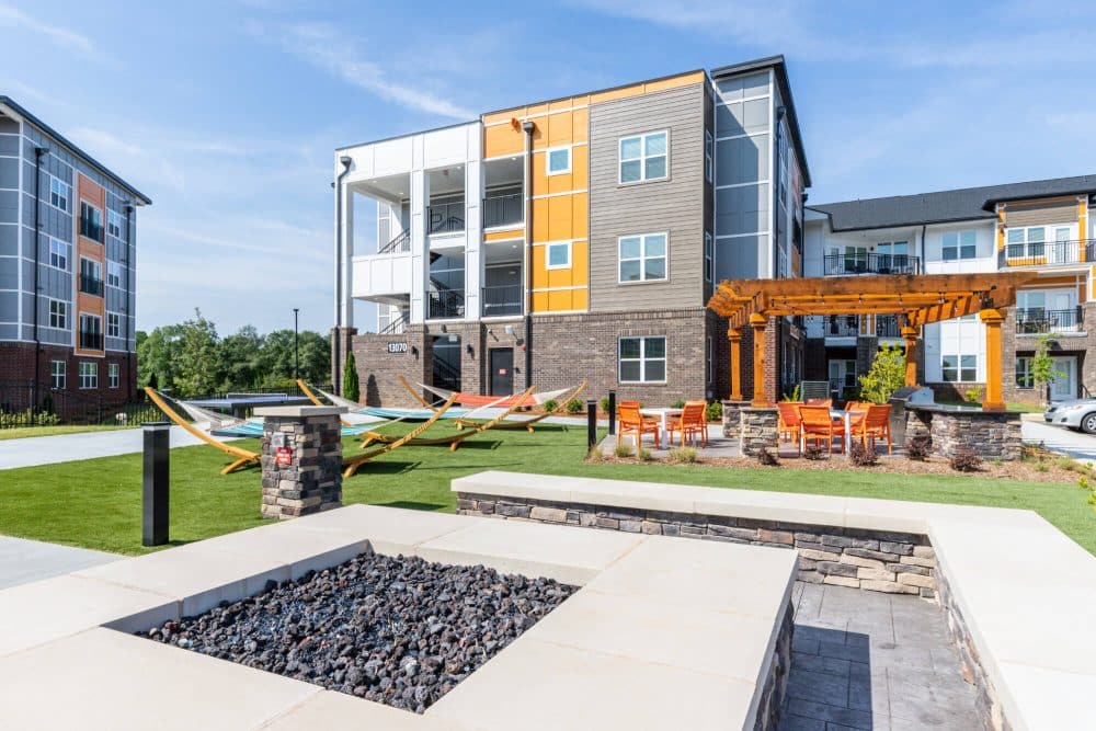 signature hartwell village off campus apartments near clemson university fire pit hammocks and outdoor lounge