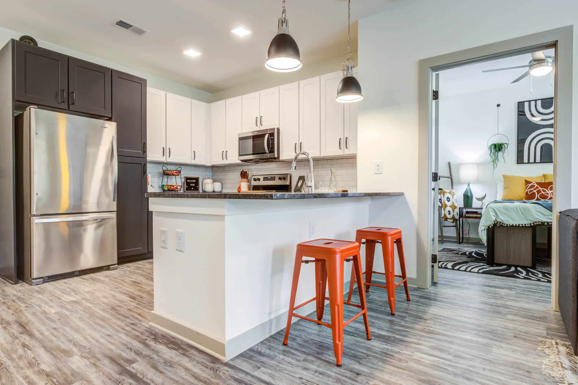 signature hartwell village off campus apartments near clemson university fully furnished apartments plank wood flooring kitchen with bar stool seating